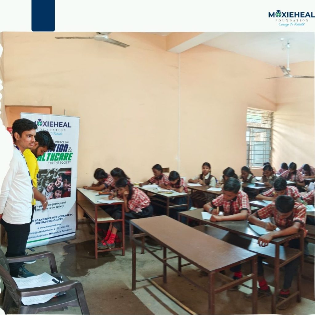 Kunal and Ritesh Volunteers of Moxieheal Foundation a best Education NGO in Chhattisgarh, Teaching students at government school