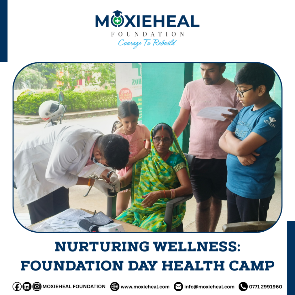 Health experts examining an elderly woman during the Free Health Check-up Camp organized by Moxieheal Foundation.